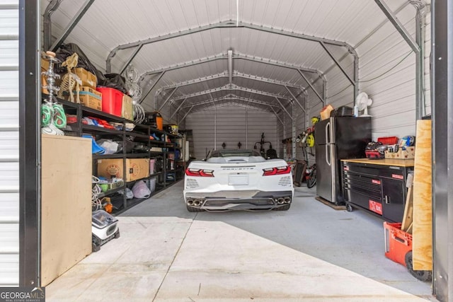 garage featuring stainless steel fridge