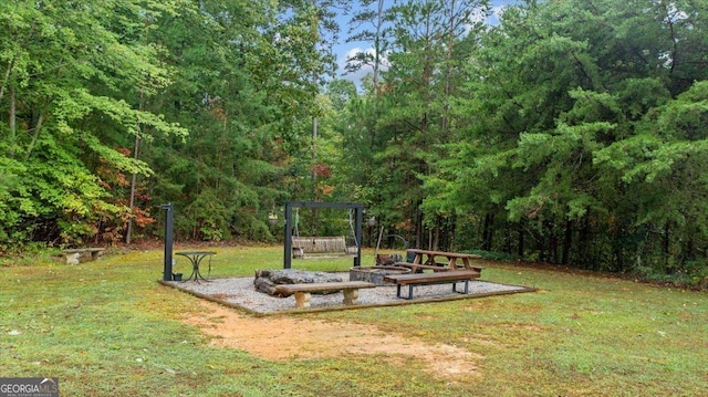 view of yard with an outdoor fire pit