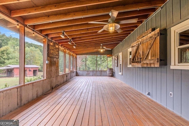 wooden deck featuring ceiling fan