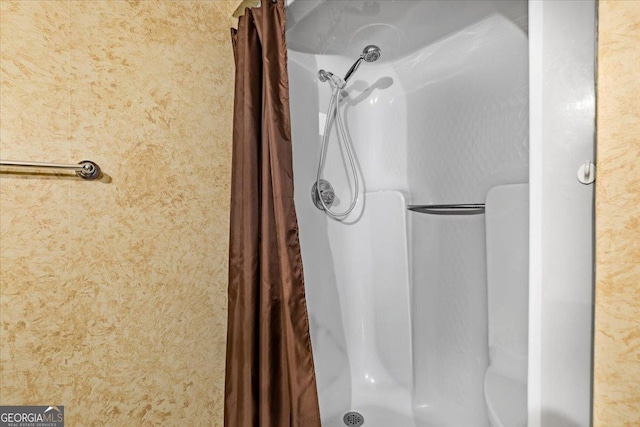 bathroom with a shower with curtain