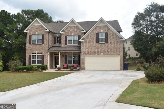 craftsman house with a garage and a front yard