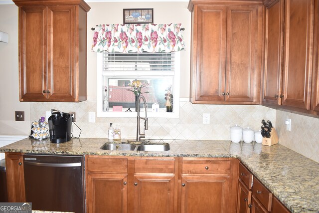 kitchen featuring sink, dishwasher, light stone counters, and backsplash