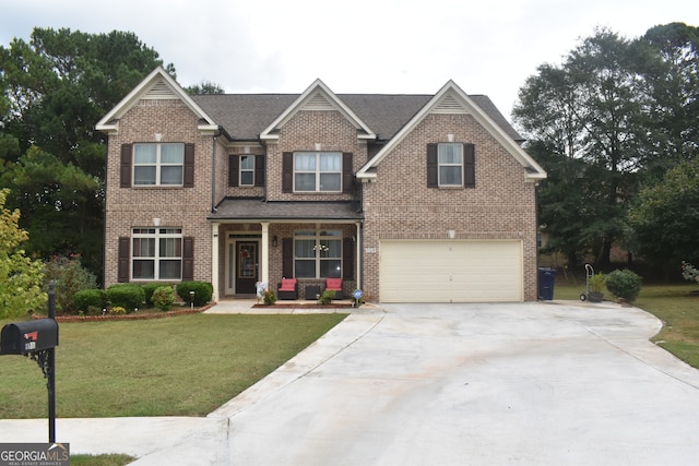 craftsman-style home featuring a front lawn and a garage