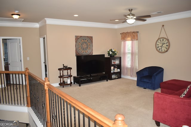 carpeted living room featuring ornamental molding and ceiling fan