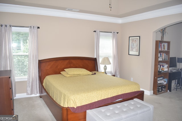 bedroom featuring light carpet and ornamental molding