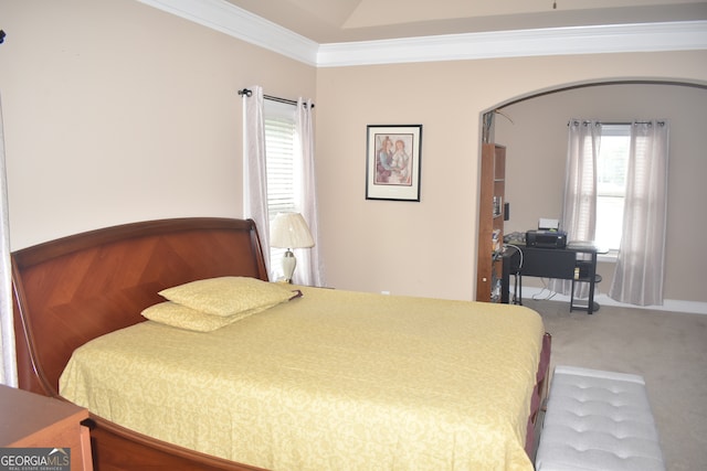 carpeted bedroom with ornamental molding