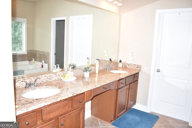 bathroom with vaulted ceiling, vanity, tile patterned flooring, and a bath