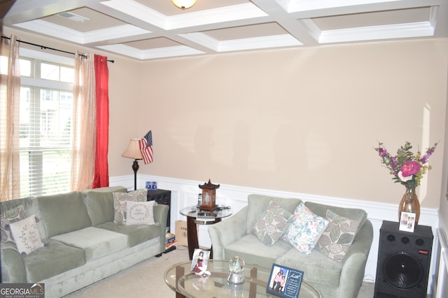 living room featuring crown molding, coffered ceiling, and beamed ceiling