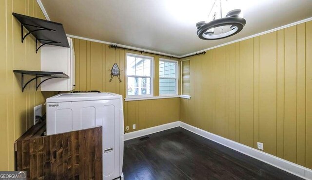 laundry room with washer / clothes dryer and hardwood / wood-style flooring