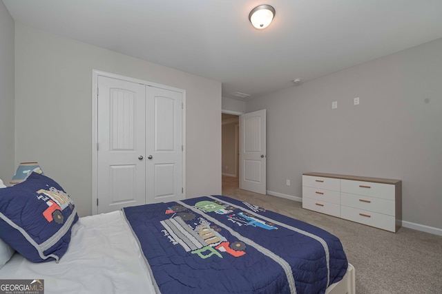 carpeted bedroom featuring a closet