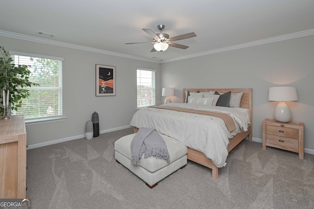 bedroom with carpet floors, crown molding, and ceiling fan