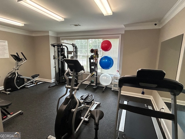 workout area featuring ornamental molding