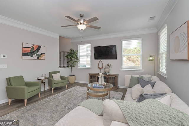 living room with ceiling fan, hardwood / wood-style floors, and ornamental molding