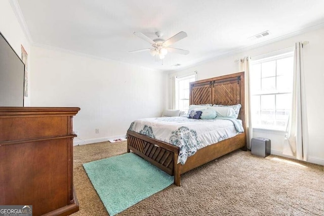 carpeted bedroom featuring multiple windows, ornamental molding, and ceiling fan