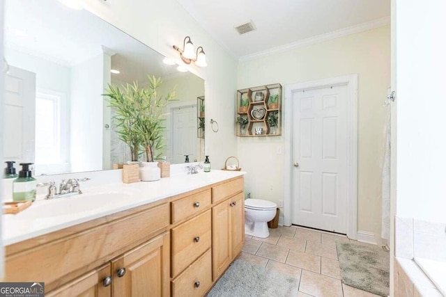 bathroom with tiled tub, vanity, crown molding, tile patterned flooring, and toilet