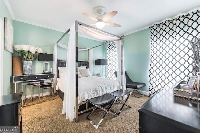 carpeted bedroom with ornamental molding and ceiling fan