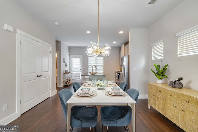 dining room featuring plenty of natural light and dark wood-type flooring