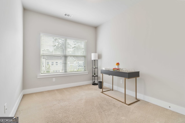 home office featuring light colored carpet