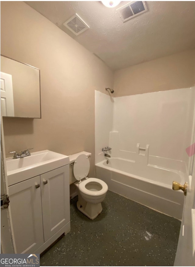 full bathroom featuring a textured ceiling, shower / bathtub combination, vanity, and toilet