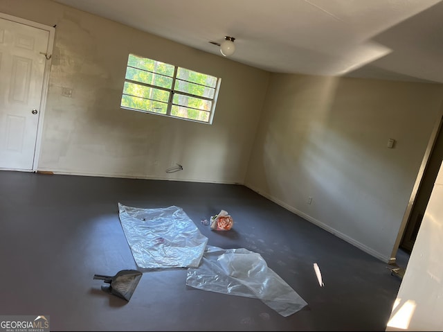 bonus room featuring concrete flooring