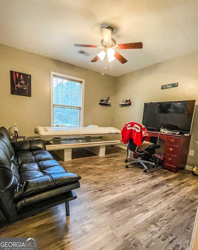 bedroom featuring wood-type flooring and ceiling fan