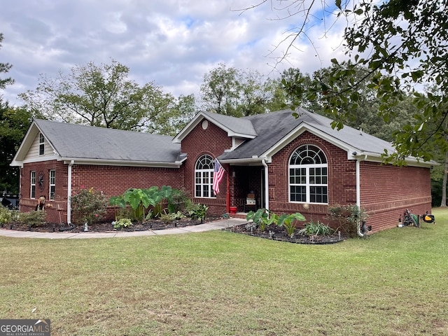 view of front of home with a front yard