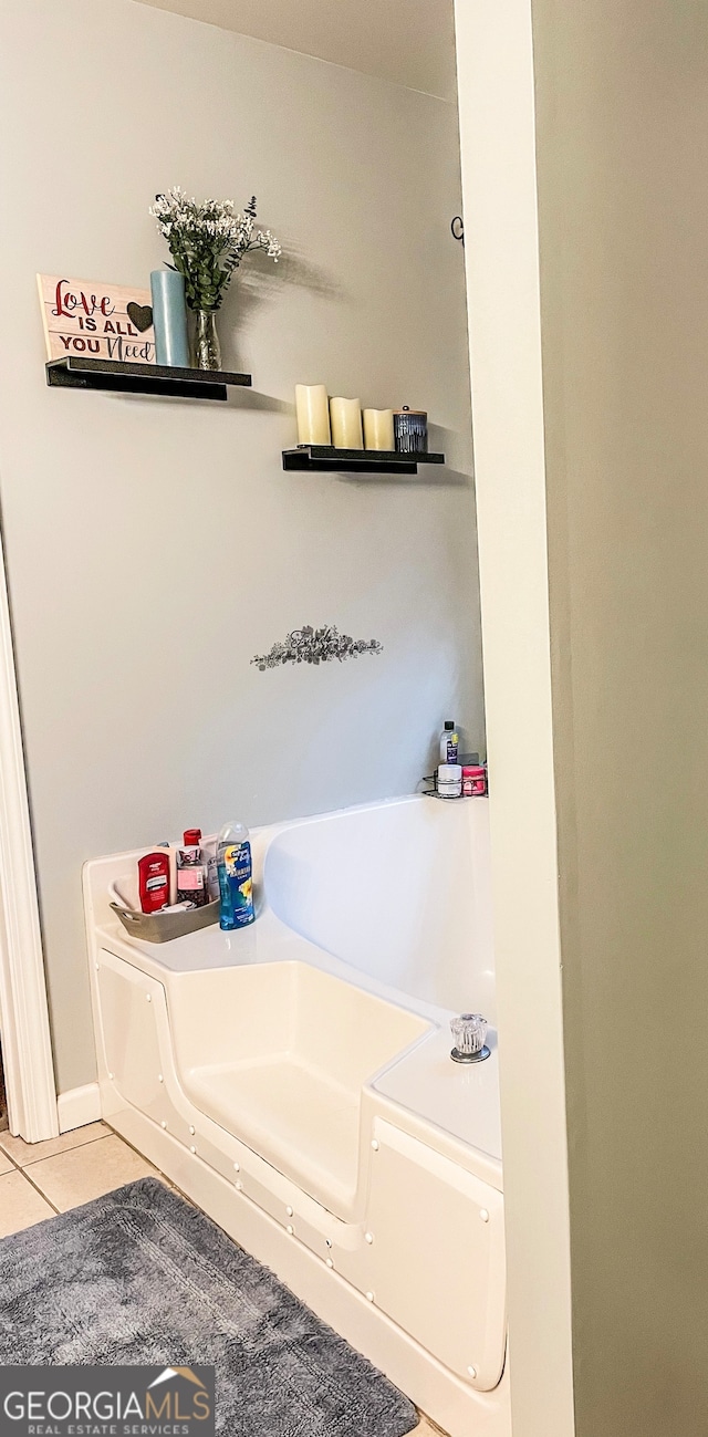 bathroom featuring a bathtub and tile patterned flooring