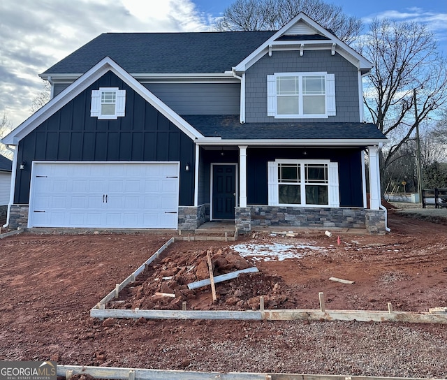 craftsman-style home featuring a garage and a porch