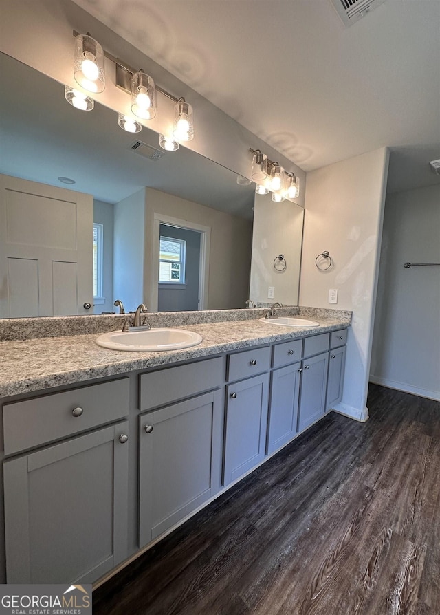 bathroom featuring vanity and hardwood / wood-style flooring