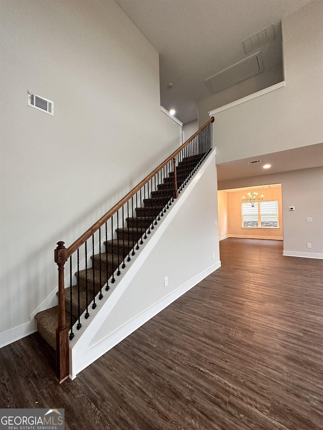 staircase featuring wood-type flooring