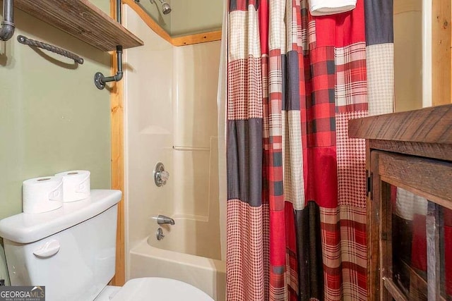 bathroom with shower / bath combination with curtain and toilet