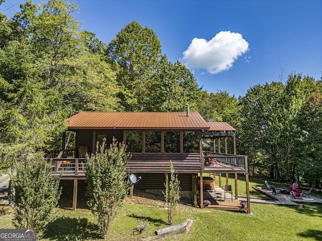 view of jungle gym with a lawn and a deck