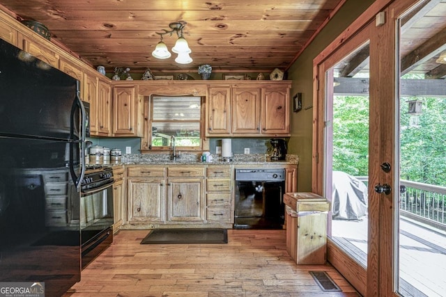 kitchen featuring wood ceiling, visible vents, a sink, and black appliances