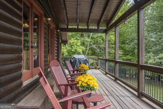 deck featuring ceiling fan and a grill