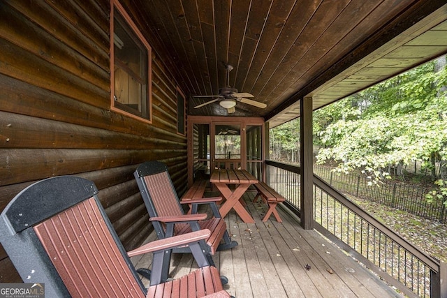 wooden deck featuring a ceiling fan and fence