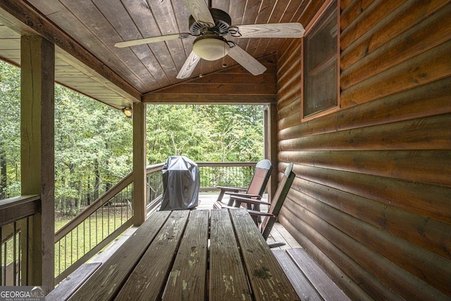 wooden deck featuring a ceiling fan