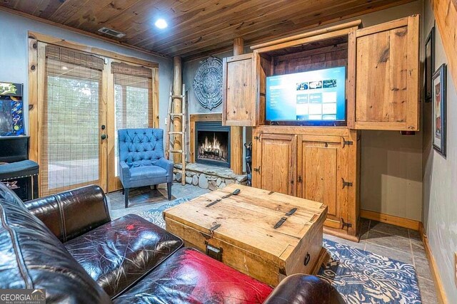 bedroom with ceiling fan, wood ceiling, and dark wood-type flooring