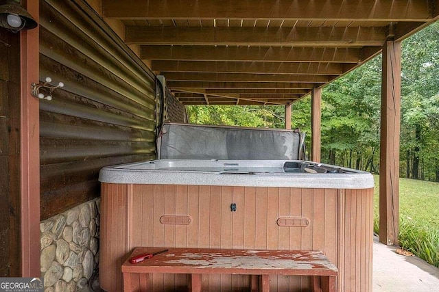 view of patio / terrace with a hot tub