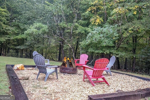 view of patio with an outdoor fire pit