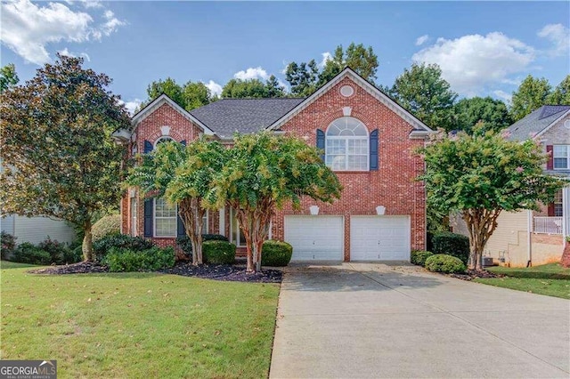 front facade with a front lawn and a garage