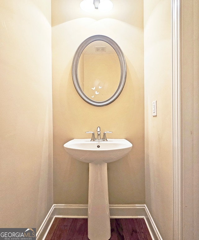 bathroom featuring hardwood / wood-style flooring and sink