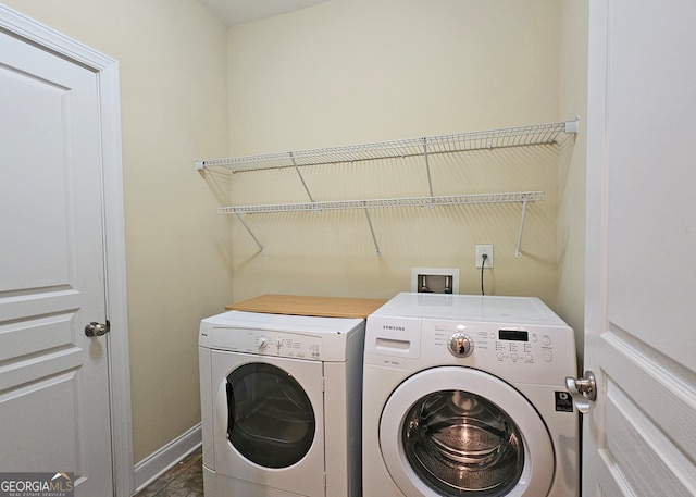 washroom with washer and dryer