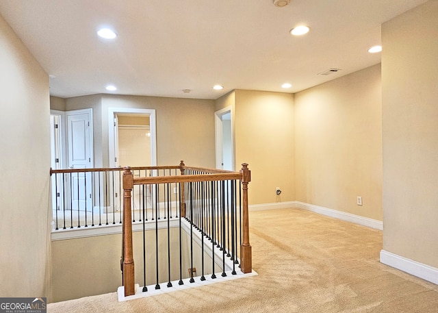 hallway featuring carpet