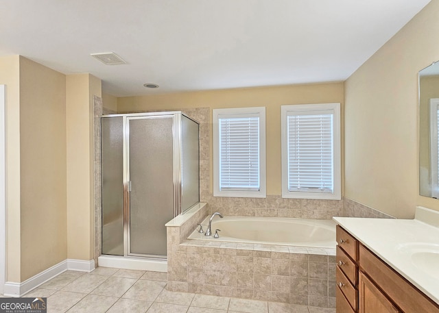 bathroom featuring shower with separate bathtub, tile patterned flooring, and vanity