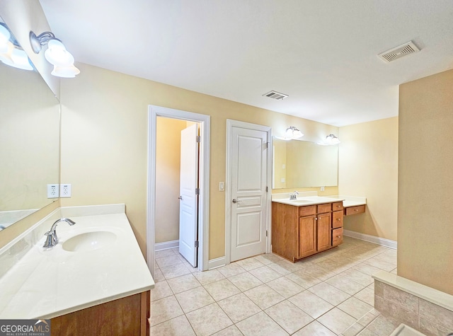 bathroom with vanity and tile patterned flooring