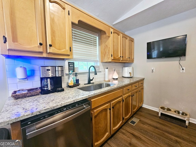 kitchen featuring dishwasher, light stone counters, sink, decorative backsplash, and dark hardwood / wood-style flooring