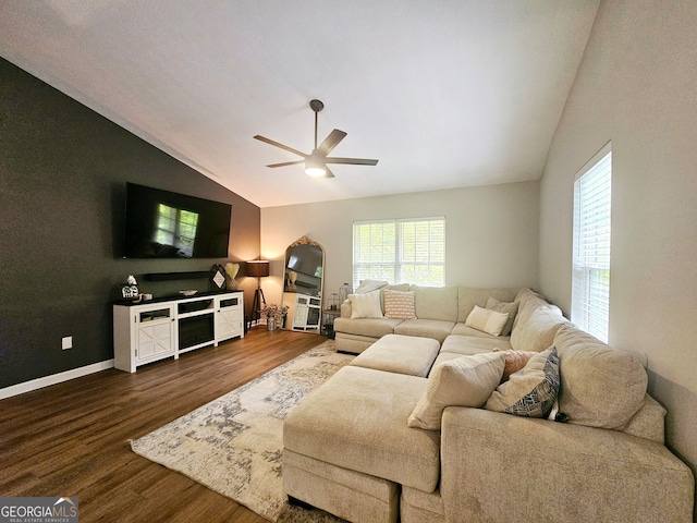 living room featuring ceiling fan, hardwood / wood-style flooring, and lofted ceiling