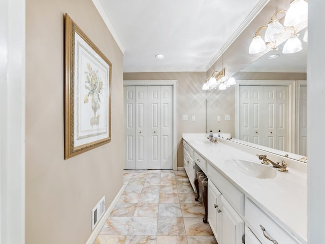 4394 Holly Springs Rd, Pendergrass, GA 30567 - bathroom featuring a sink, double vanity, baseboards, visible vents, and ornamental molding