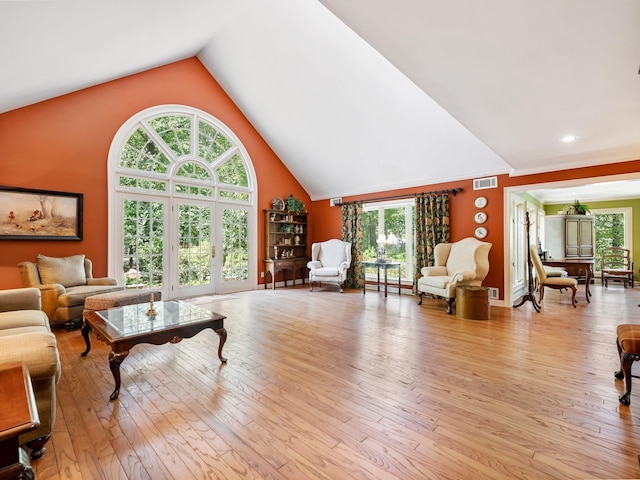 4394 Holly Springs Rd, Pendergrass, GA 30567 - living room featuring visible vents, high vaulted ceiling, and light wood-style flooring