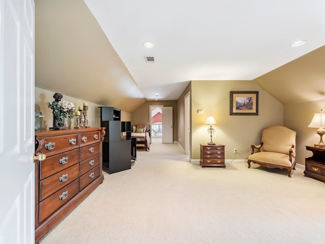 sitting room featuring lofted ceiling and carpet